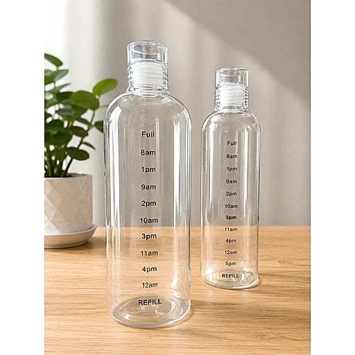Two clear water bottles with time markings on a wooden surface.