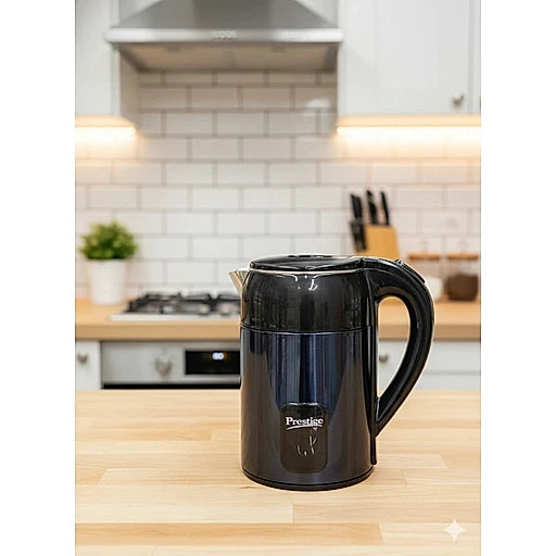 Black Prestige kettle on a kitchen counter with a tiled backsplash and wooden cabinets.