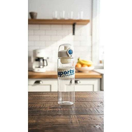 Clear water bottle with 'sports' label on a wooden table in a kitchen.