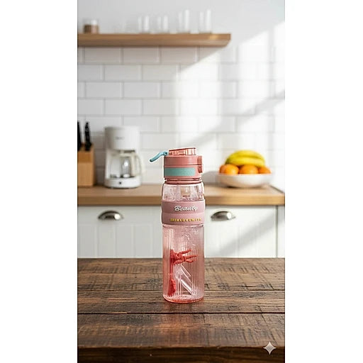 Pink water bottle with blue straw on a wooden table in a kitchen.