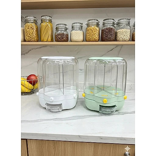 Two clear plastic food storage containers with lids, one white and one mint green, displayed on a kitchen countertop with shelves of jars in the background.
