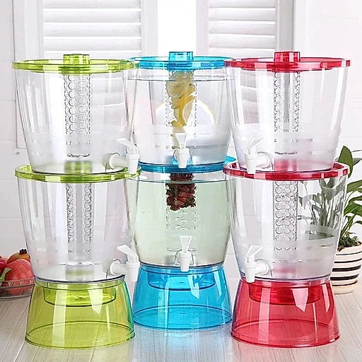 Three colorful juice dispensers on a wooden surface with a white background.